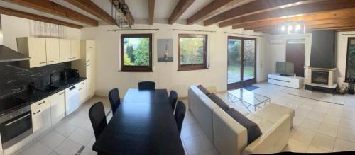a living room with a couch and a table at MB House Sarbinowo in Sarbinowo