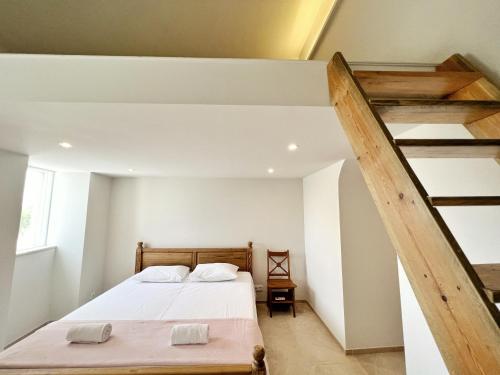 Ένα ή περισσότερα κρεβάτια σε δωμάτιο στο Casa Tuia Resort