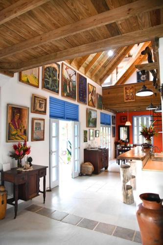 a large room with paintings on the walls at Harmony Villa in Pont Cassé