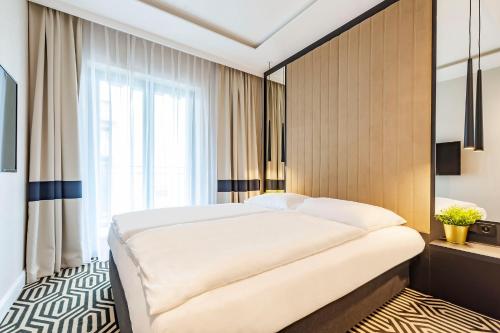 Posteľ alebo postele v izbe v ubytovaní VacationClub - Baltic Park Fort Apartament G.209