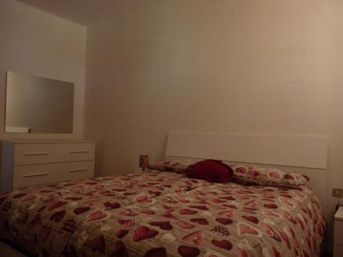 En eller flere senge i et værelse på Appartamento El Bacan