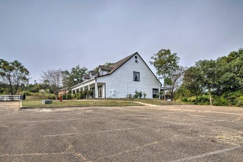 an empty parking lot in front of a white house at Starkvegas Clubhouse about 2 Mi to MSU Campus! in Starkville
