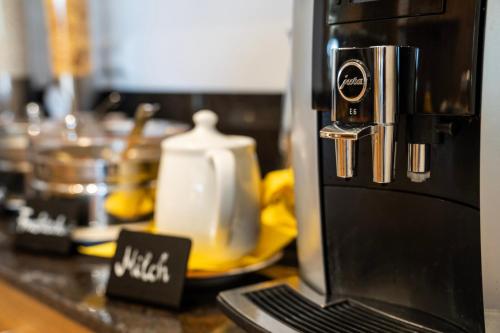 a coffee maker on a counter in a kitchen at Wellness Landhaus Parth in Ossiach