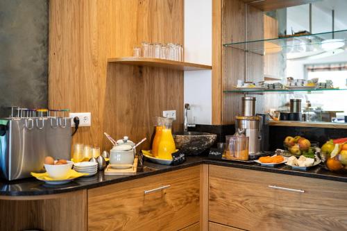 a kitchen with a counter with fruit on it at Wellness Landhaus Parth in Ossiach