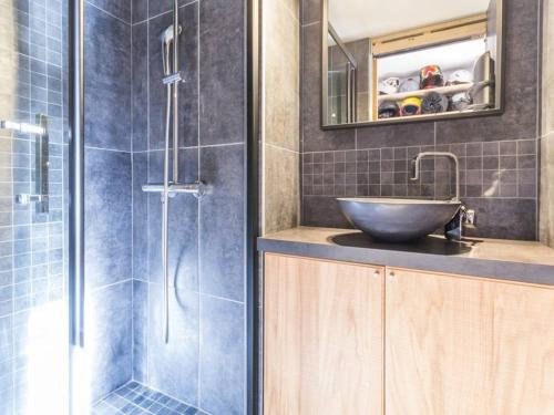 a bathroom with a sink and a glass shower at Appartement Les Arcs 1800, 4 pièces, 8 personnes - FR-1-346-321 in Arc 1800