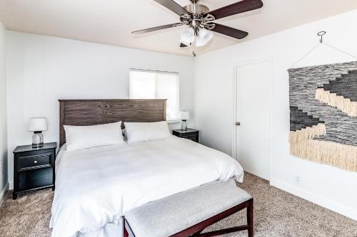 a bedroom with a bed and a ceiling fan at Pine Ridge Peak in Oakhurst