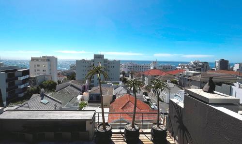 a view of a city with palm trees and buildings at Namaste in Cape Town