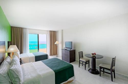 Ένα ή περισσότερα κρεβάτια σε δωμάτιο στο Holiday Inn Campeche by IHG