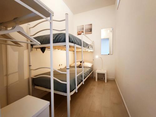 a room with two bunk beds in it at Casa Alexandra in Castelsardo