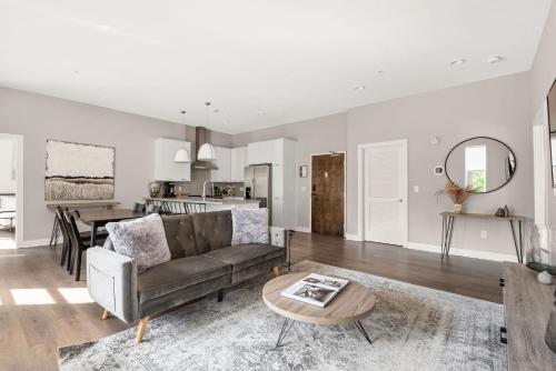 a living room with a couch and a table at Mason Lofts at West End in Nashville