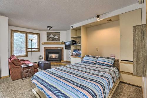 a bedroom with a bed and a fireplace at Iron Horse Studio with Resort Amenities Walk to WP! in Winter Park