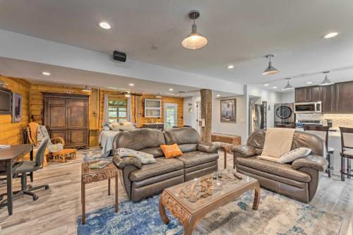 a living room with a couch and a table at Cozy Wisconsin Studio, 11 Mi to Lake Geneva! in Burlington