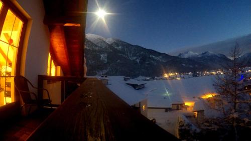 a room with a view of a snow covered mountain at Privathaus Achensee in Achenkirch