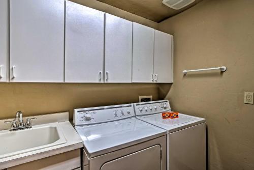 a kitchen with a white stove top oven next to a sink at Beautiful Breck Retreat Walk to Gondola and Main St in Breckenridge