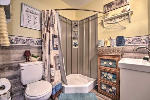 a bathroom with a toilet and a shower and a sink at Cozy Goshen Farm Studio Ideal for Extended Stays! in Goshen