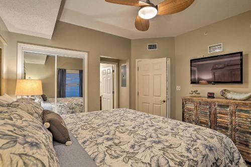 a bedroom with a bed and a flat screen tv at Resort Pool, Gym & Hot Tub: Beachfront PCB Condo! in Panama City Beach