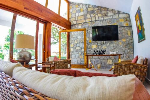 TV a/nebo společenská místnost v ubytování Finca Thakni' Casa de Campo