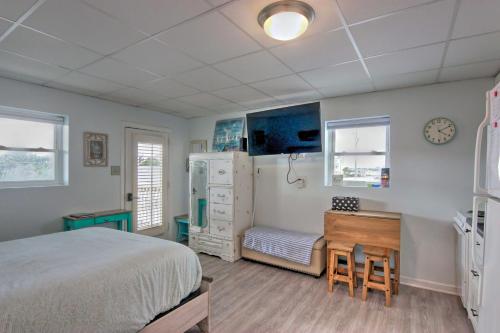 a bedroom with a bed and a desk and a drawer at Atlantic Beach Studio with Community Pool! in Atlantic Beach