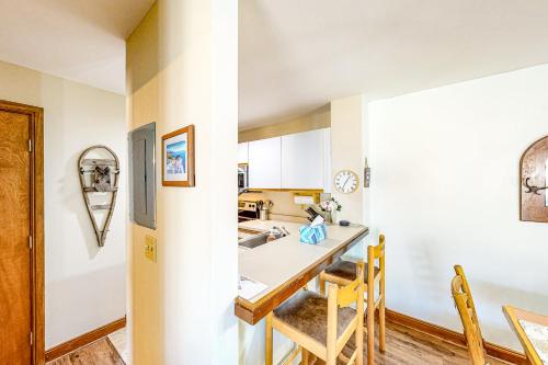a kitchen with a table and chairs in a room at All Season Mountain Retreat in Dover