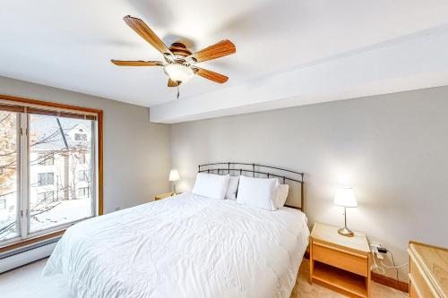 a bedroom with a bed and a ceiling fan at All Season Mountain Retreat in Dover