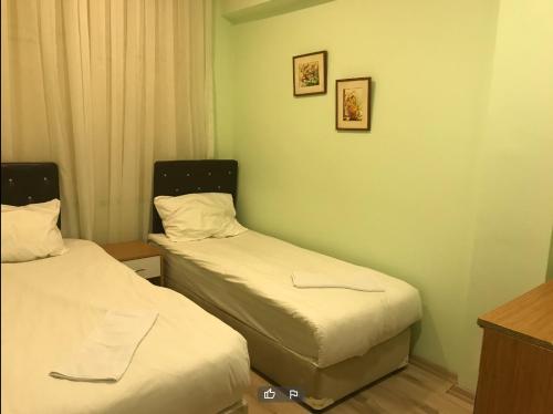 En eller flere senge i et værelse på Ottoman Time Hotel