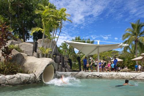 a group of people in a pool at a resort at Radisson Blu Resort Fiji in Denarau