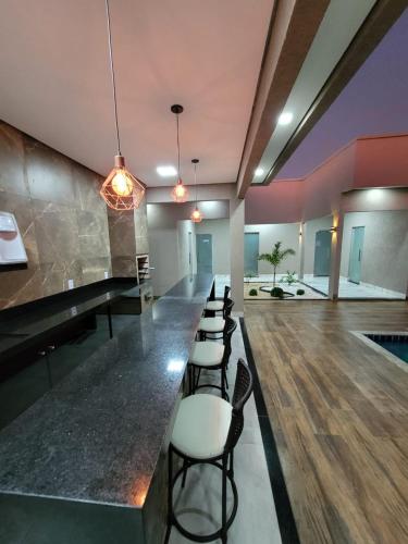 Posezení v ubytování CASA ARUANÃ 5 SUITES