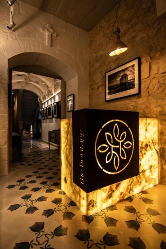 a room with a box on the floor at The Mdina Heritage Boutique Hotel - By Luxury Villas International in Rabat