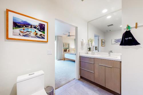 a bathroom with a sink and a toilet at Cerritos Style Permit #48864 in Palm Springs