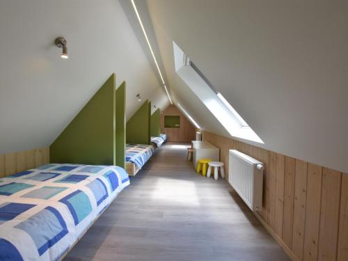 a room with three beds and a row of lights at Holiday Home with pond in Poperinge in Beveren