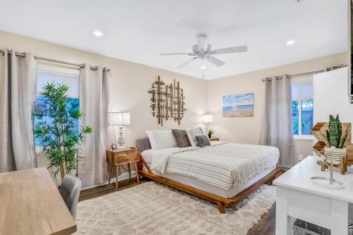a bedroom with a bed and a ceiling fan at Salt & Light in Saint Augustine