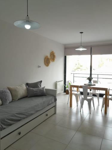 a living room with a couch and a table at Alquiler temporario in Tandil