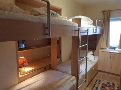 a room with two bunk beds and a window at Appartement Courchevel 1550, 3 pièces, 6 personnes - FR-1-514-74 in Courchevel
