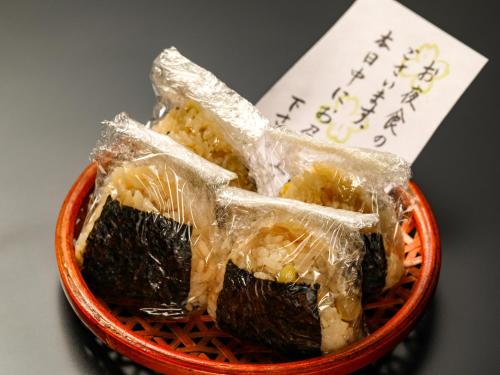 a bowl of food in plastic bags on a table at Keiryuso Siorie in Matsumoto