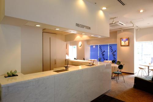 a large room with a kitchen with a counter at 2nd inn in Osaka