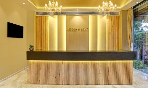 a lobby with a reception desk in a building at Treebo Tryst Golden Bliss Trimurti Nagar Square in Nagpur