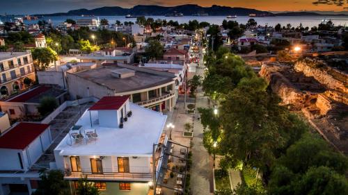 an aerial view of a city at night at Eleusis Suites Α in Elefsina