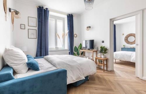 Ένα ή περισσότερα κρεβάτια σε δωμάτιο στο Appart Deluxe Confort avec Parking Privé