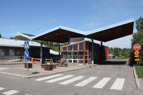 
a parking lot with a large building at Rastila Camping Helsinki in Helsinki
