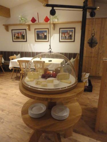 a table with a plate of food in a room at Maurerhof Itter in Itter