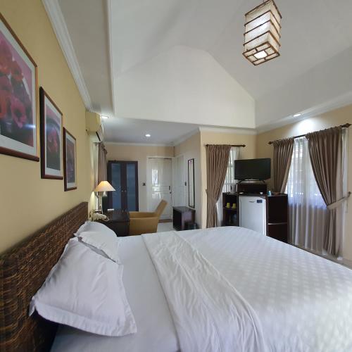 Ένα ή περισσότερα κρεβάτια σε δωμάτιο στο Tengger Guesthouse