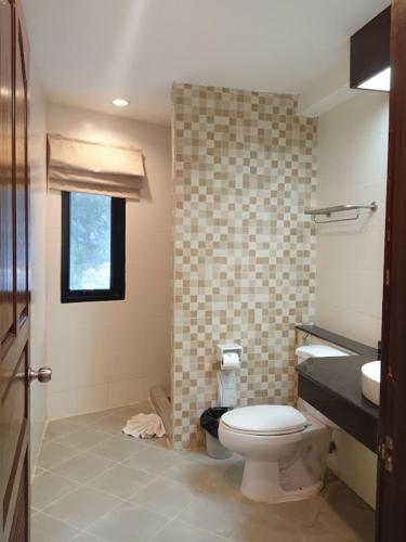 a bathroom with a toilet and a sink at Sea Star House in Ao Nang Beach