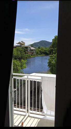 a view of a river from a balcony at Charlie's Angels Hotel Restaurant in Rawai Beach