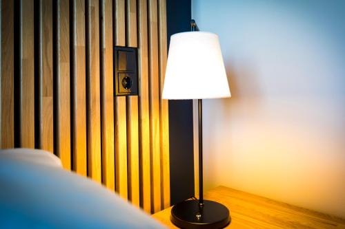 a lamp sitting on a table in a room at Break Sokos Hotel Koli in Kolinkylä