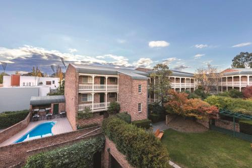 an aerial view of a building with a swimming pool at Adina Serviced Apartments Canberra Kingston in Canberra