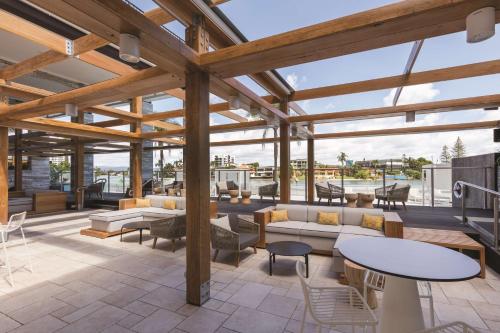 a pavilion with tables and chairs on a patio at Vibe Hotel Gold Coast in Gold Coast