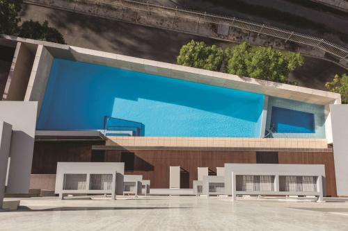 a rendering of a building with a swimming pool at Adina Apartment Hotel Perth in Perth