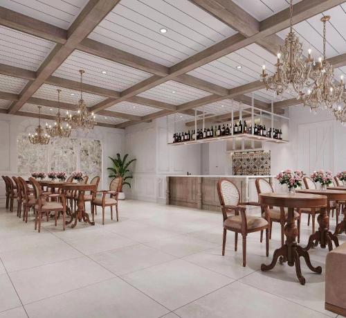 a large dining room with tables and chairs and chandeliers at Hangzhou Lighting Lanshan Youth Hostel in Hangzhou