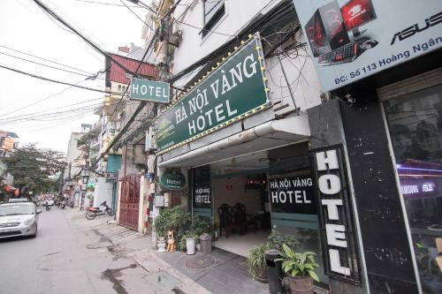 a building with a sign for a hotel on a street at Ha Noi Vang Hotel Hoang Ngan in Hanoi
