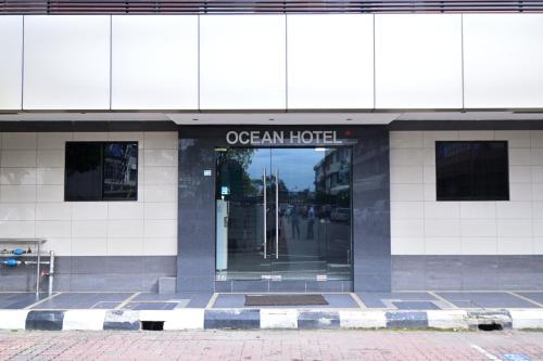 a building with the entrance to an ocean hotel at OCEAN HOTEL in Labuan